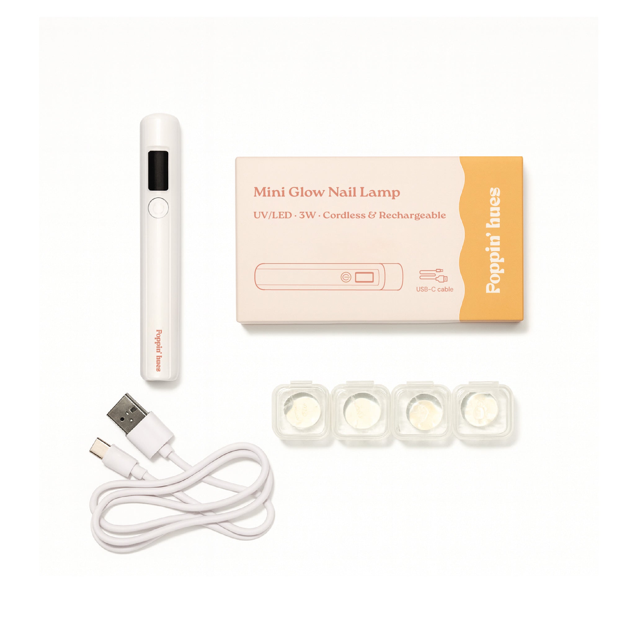 Handheld rechargeable UV/LED nail lamp kit displayed on a white background, including the lamp, product box, USB charging cable, and four silicone tips.