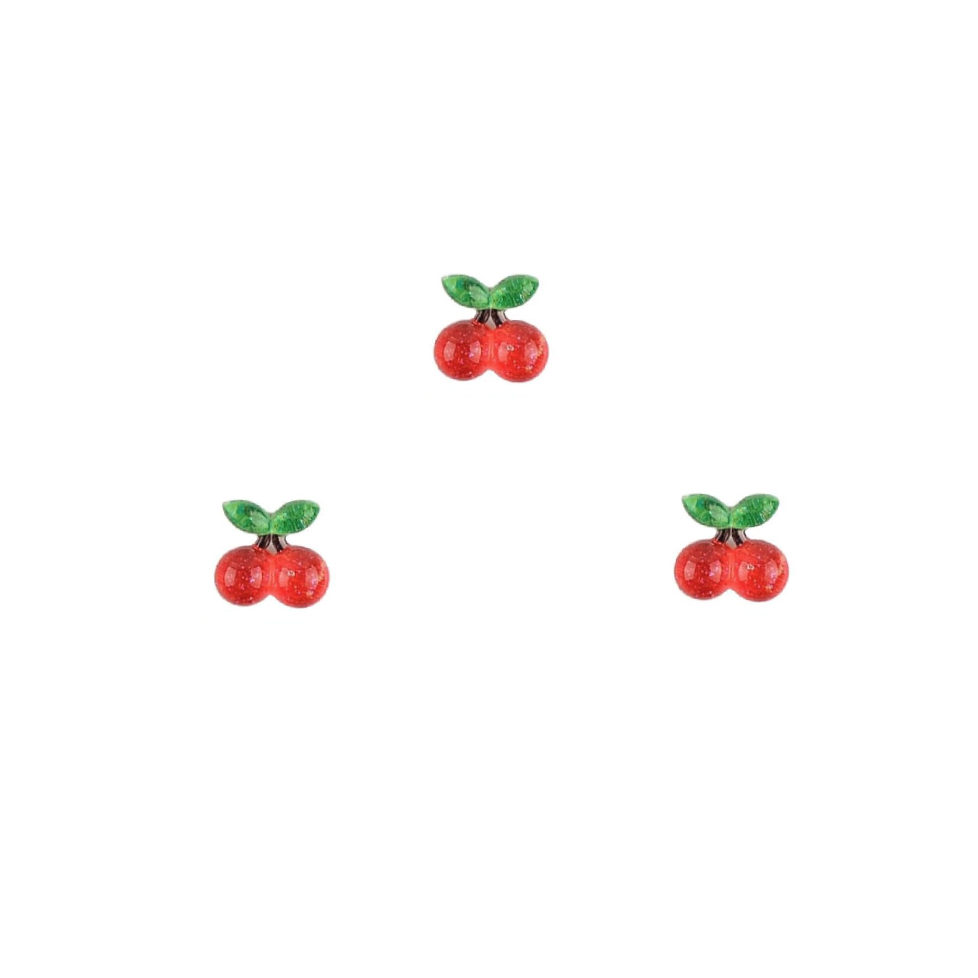 Three cherry-shaped nail charms on a white background