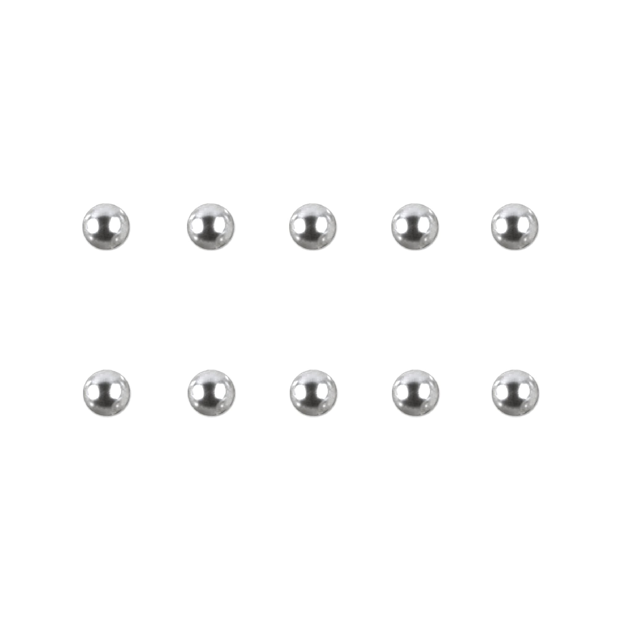 Set of silver chrome nail charms on a white background