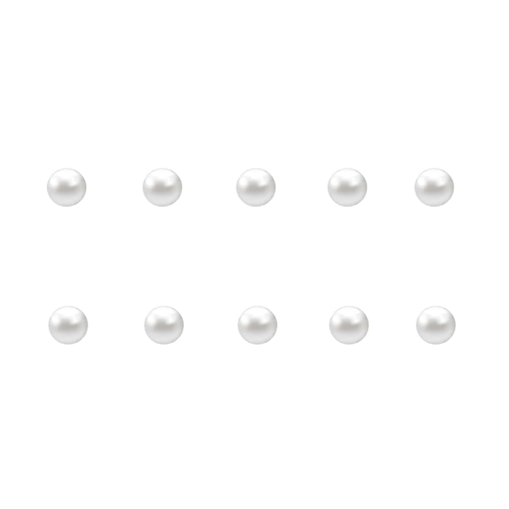 Set of small pearl nail charms on a white background
